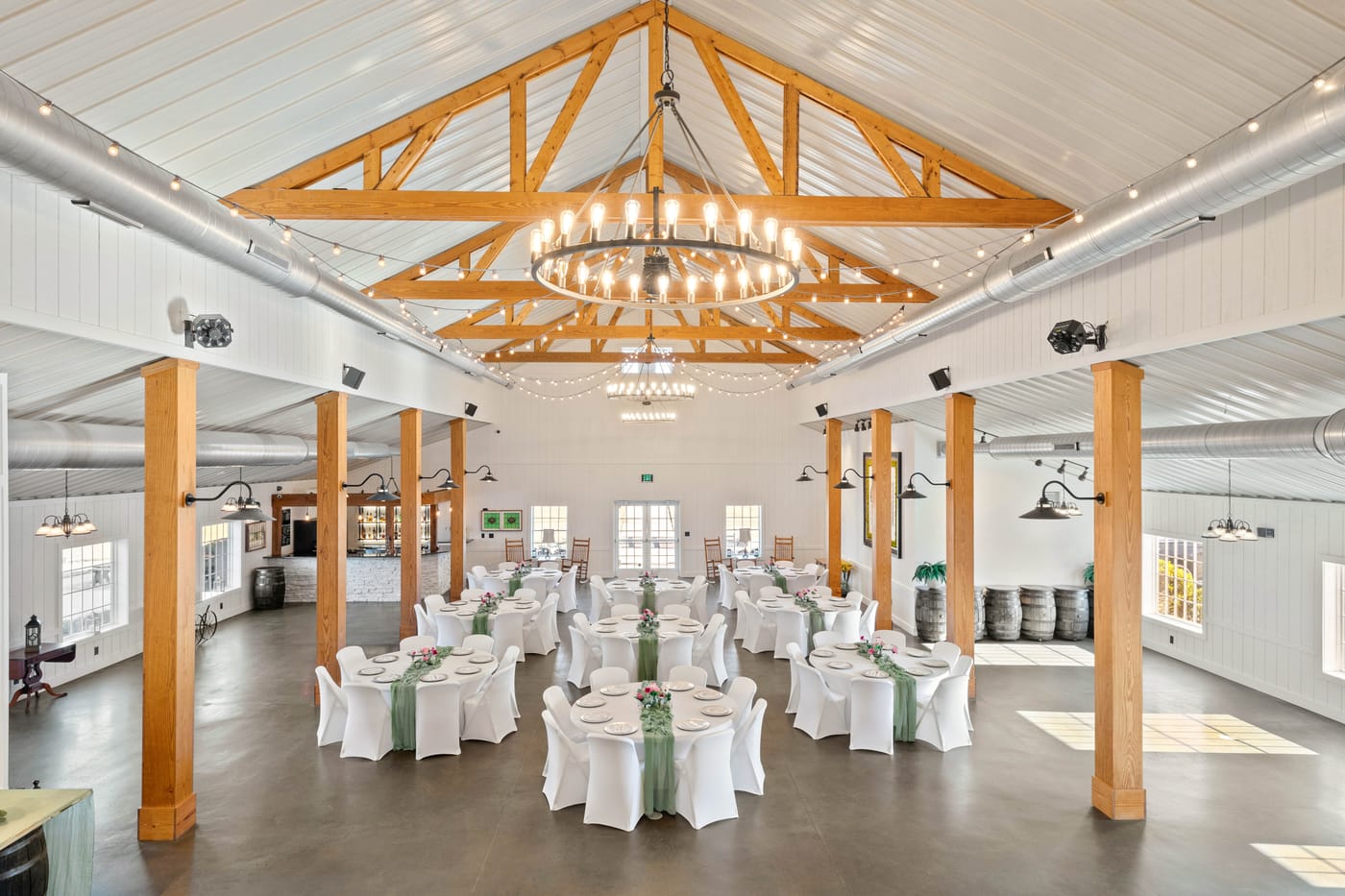 The venue at Carrollock Farms, set for an evening event beneath the chandelier