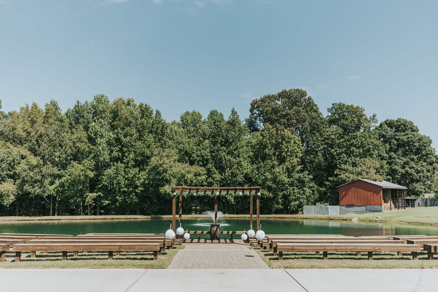 The ceremony site at Carrollock Farms, with the pergola and guest benches
